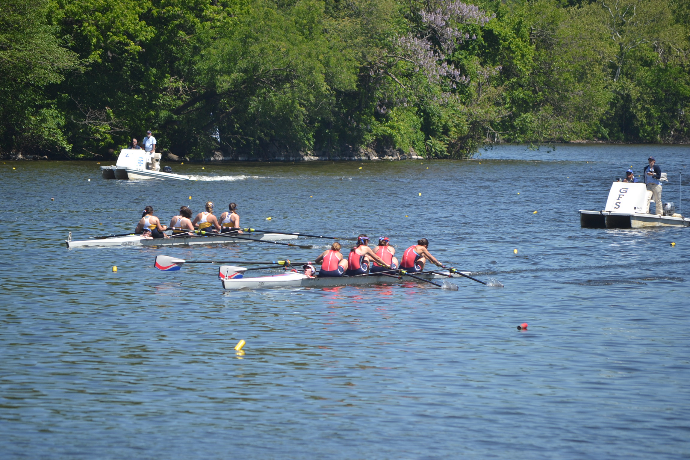 Riverside rowers racing a four with the team’s red, white and blue oars