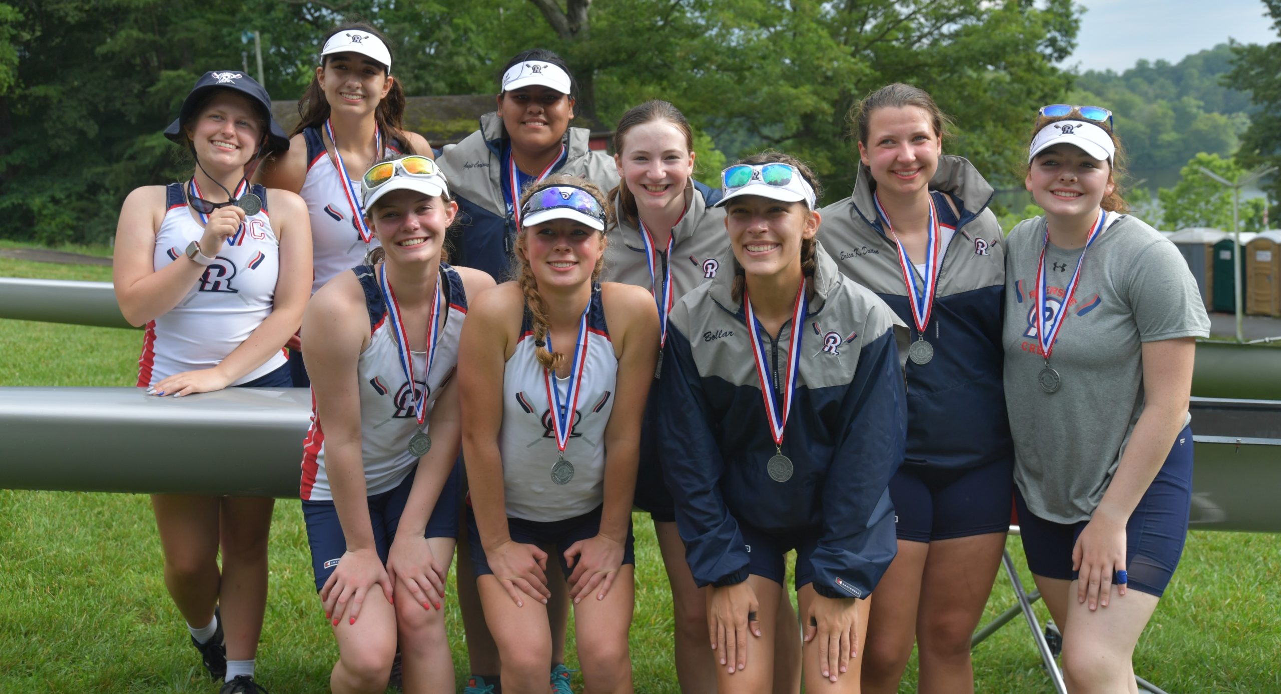 Riverside teammates smiling together with their medals